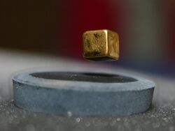 A magnet is suspended over a liquid nitrogen cooled high-temperature superconductor (-200°C)