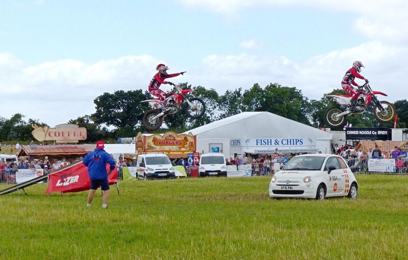File:Morcycle jumping at a country fair (England) arp.jpg