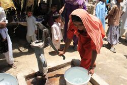 Providing clean water and flood-resistant shelter in Sindh (5950788649).jpg