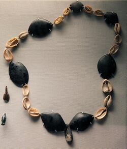 British Museum Middle east 14022019 Necklace Obsidian beads and cowrie shells Halaf period 3645.jpg