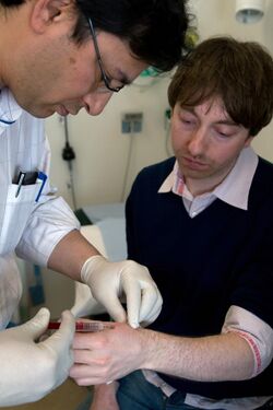 Dr Mark Gasson has an RFID microchip implanted in his left hand by a surgeon (March 16 2009).jpg