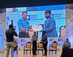 Sisir Radar CEO Soumya Misra accepting iDEX award from IAF.jpg