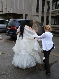 Oxford sham marriage - Would-be-bride is escorted away.jpg