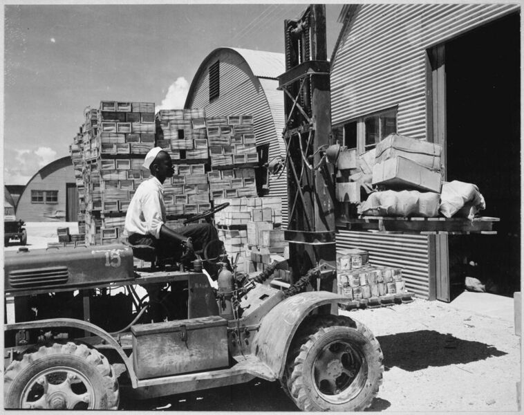 File:"M. D. Shore, S1-c, operating a forklift truck at the Navy supply depot at Guam, Marianas.", 06-08-1945 - NARA - 520685.jpg