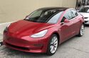 Tesla Model 3 parked, front driver side.jpg