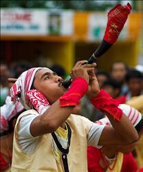 Bihu dancer with a horn.jpg