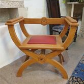 Image of the Bishop's chair, near the altar, formerly situated in the Hospitallers' Room, in the Church of St Mary the Blessed Virgin, Sompting. Constructed of oak with a red leather seat.