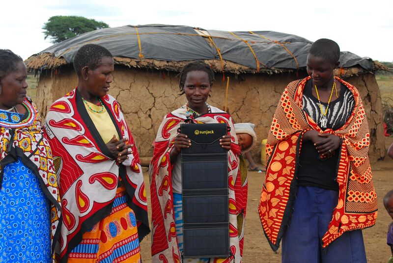 File:Rural African Villagers Holding Portable Solar Charger.jpg