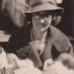 Dr Freda Gibson in 1935 with lots of babies (cropped).png