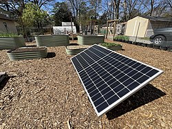 Photovoltaic solar panels provide clean electricity for this land lab.  Using local power to operate garden tools, sensors, cameras, and water pumps provides a great example of sustainable energy for students.