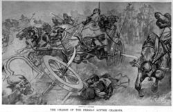 The charge of the Persian scythed chariots at the battle of Gaugamela by Andre Castaigne (1898-1899).jpg