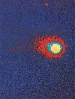 False color image of the comet, which appears as a bright object at center-right