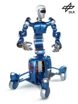 A shiny blue and silver humanoid robot on wheels