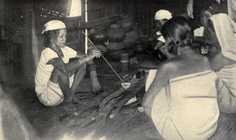 File:An Itneg shaman renewing an offering to the spirit shield (1922, Philippines).jpg