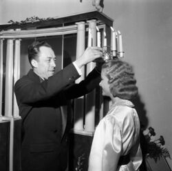 Camus crowning Stockholm's Lucia after accepting the Nobel Prize in Literature.
