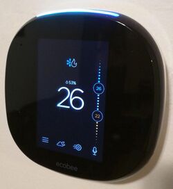 Ecobee4 on the wall from an angle showing home screen.jpg