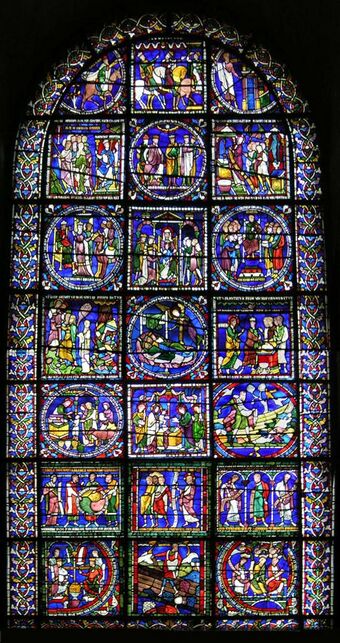 The window has a simple round-arched top. The stained glass is supported by a lead armature of squares and circles which divide it into many separate pictures. The upper pictures show the story of the Three Wise Men. The lower part has an assortment of biblical scenes including "The Sower". The background colour is deep blue.