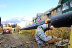 A skilled worker welding a pipe in British Columbia, Canada, in 2014