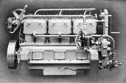 Wolseley marine oil engine. The cylinders, with monobloc heads, are cast in pairs with a prominent water jacket over their upper halves alone.