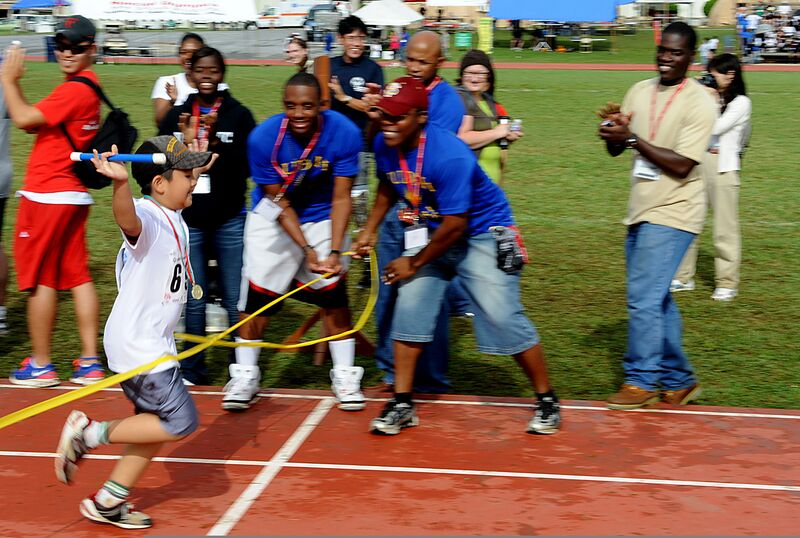 File:A Special Olympics (SO) athlete crosses the finish line after completing the last leg of a 400 meter relay race during the Kadena Air Base SO event in Okinawa, Japan, Nov 111105-F-FL863-002.jpg