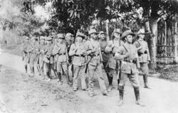 Soldiers marching through the jungle