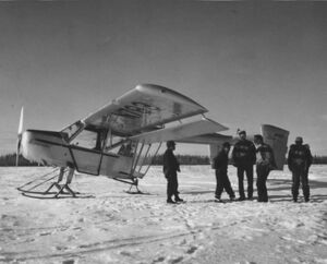 Pilot and crew members with plane.jpg