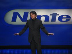 Satoru Iwata giving a presentation.