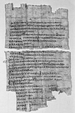 Black and white photograph of a fragment of papyrus with Greek text