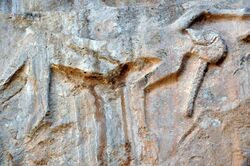 Detail, a dead or dying Lullubian warrior. Darband-i Gawr rock-relief, Mt. Qaradagh, Sulaymaniyah, Iraq, 2200-2000 BCE.jpg