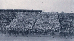 Singing The Yellow and the Blue between halves of the Penn Game, 1916.png