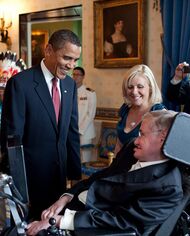 Photograph of Barack Obama talking to Stephen Hawking in the White House
