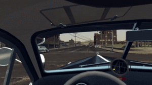 The player (in first-person) drives a car through the streets of Los Angeles.