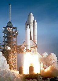 The Space Shuttle Columbia launching on the first Space Shuttle mission