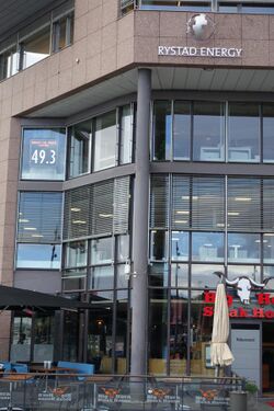 Office of Rystad Energy at Aker brygge in Oslo, Norway, sign showing Brent oil price.jpg
