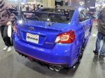 Subaru WRX STI S208, a limited-production high-performance automobile. This is a rear view of the car, showing its blue color, high trunk-mounted spoiler, and nameplate.