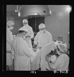Young nurses assist at an appendectomy 8b07788v.jpg