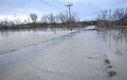 Lick Creek floods over Pottertown Road in Mosheim.