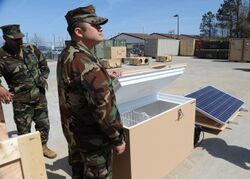 Naval Special Warfare support technicians receive training on a solar-powered refrigerator March 12, 2012, at Joint Expeditionary Base Little Creek-Fort Story, Va 120312-N-AT856-010.jpg