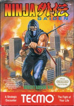 The logo of Ninja Gaiden is on the top of the screen. In the middle of the image is a depiction of a ninja in blue with a knife in his left hand and a bo and katana stored on his back. The ninja is portrayed in a background of a burning city. Below the ninja is green text saying in caps "BIGGEST ARCADE HIT!", and to the left and right of that text are Nintendo's license notice and Seal of Quality respectively. In the bottom of the image, in red with white lettering, is the TE©MO logo, with text to the left of the logo saying "A Strategic Encounter" and with text to the right of the logo saying "The Fight of Your Life".