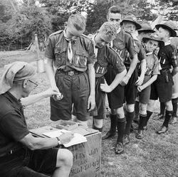 Pay Day for Boy Scouts at a fruit-picking camp near Cambridge in 1943. D16223.jpg