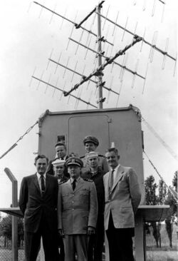 Radio Control Hut and Team Overseas Bottom left to right: Howard O. Lorenzen Countermeasures Branch Head CDR Irving E. Willis Site Executive Officer William Edgar Withrow Radio Control Hut Engineer Middle left to right: PO2 Lee Interrogation Operator PO1 Hilbert R. Hubble Interrogation Operator Top left to right: Reid D. Mayo GRAB Project Officer