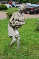 Statue of a woman carrying a baby in National Museum Centre-Lagos.jpg