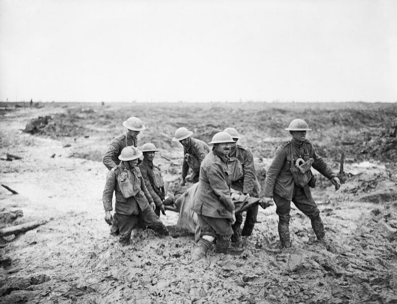 File:A team of stretcher bearers struggle through deep mud to carry a wounded man to safety near Boesinghe on 1 August 1917 during the Third Battle of Ypres. Q5935.jpg