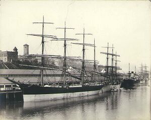 Four-masted bark PLACILLA along with other sailing vessels and steamships at the Northwestern Inprovement Co dock, Tacoma (HESTER 126).jpeg