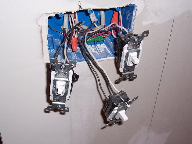 File:Three light switches with exposed wiring.jpg