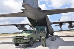 Unloading a CUCV vehicle and a trailer from a C-130H Hercules.jpg