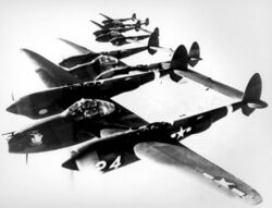 4 Lockheed P-38 Lightnings in formation.jpg