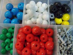 brightly colored plastic balls with holes in them.
