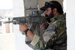 Afghan border police aiming a weapon.jpg