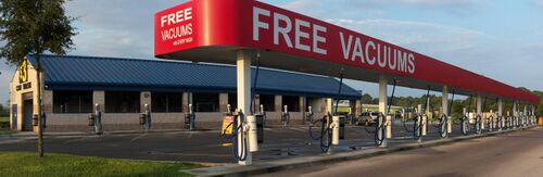 Automotive vacuums in Bayonet Point, Florida. Although the prominent sign says "free", a paid car wash is required first.